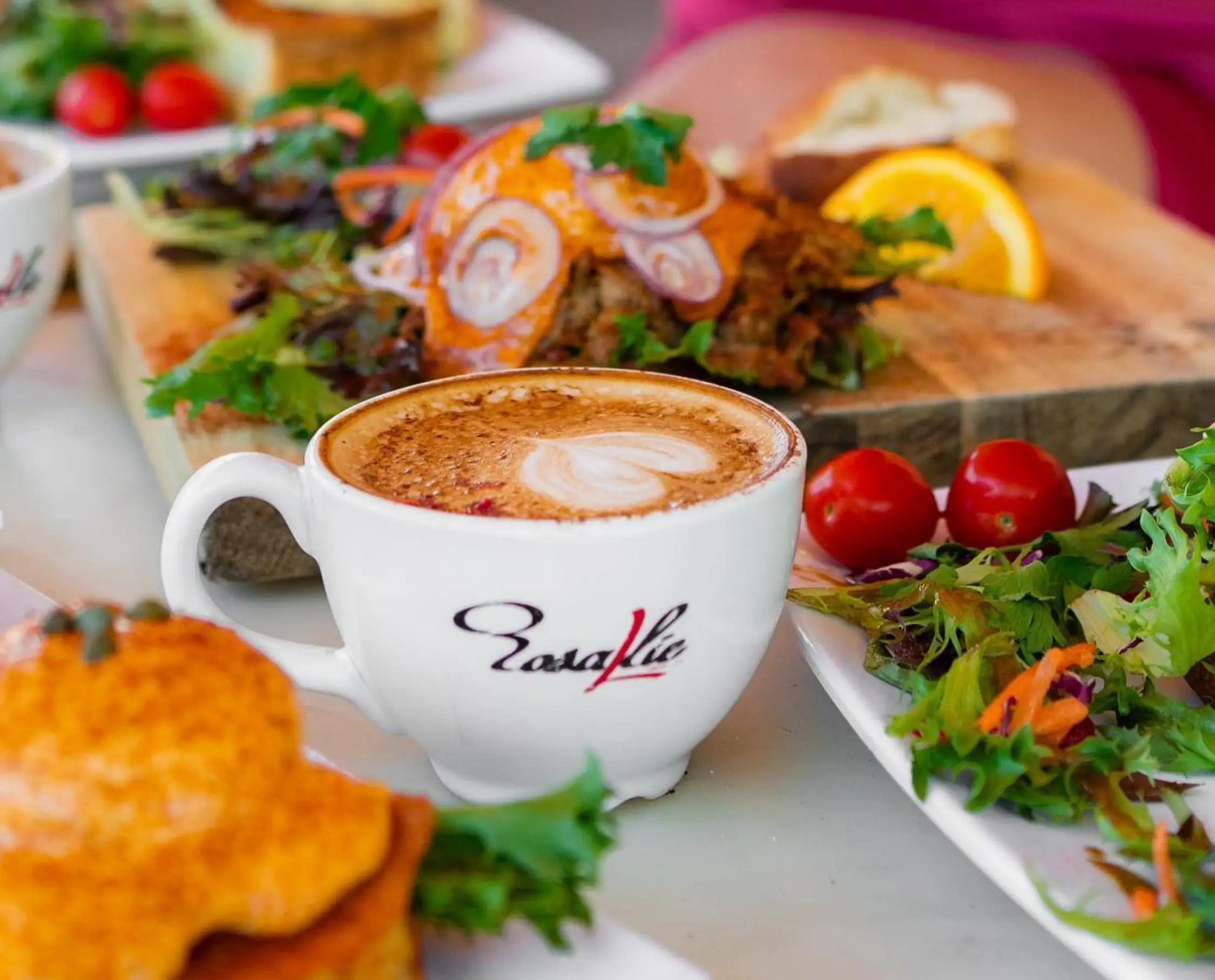 Rosallie coffee and foods on the background